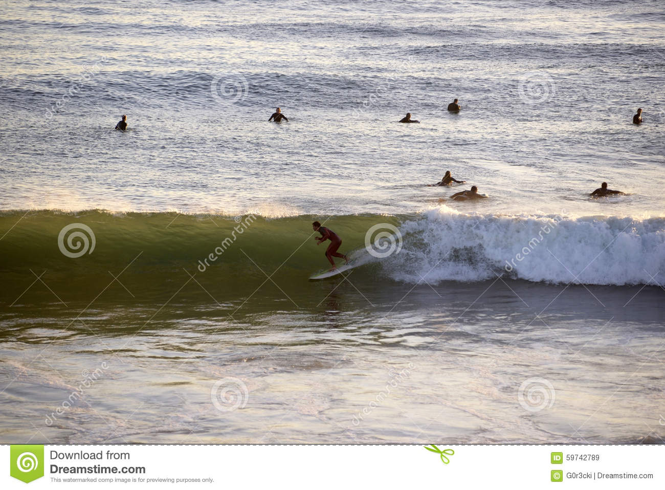 Picture of surfers entering the water.